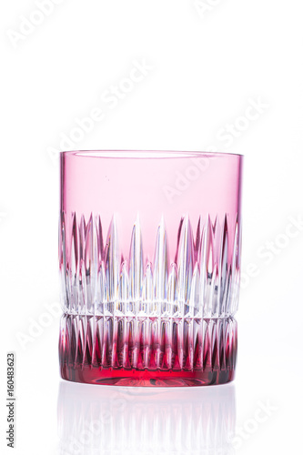 Red crystal glass on a white background