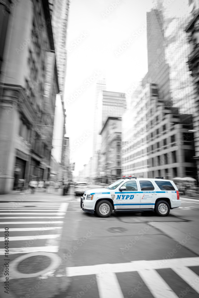 Fast NYPD SUV driving through Manhattan Colorkey