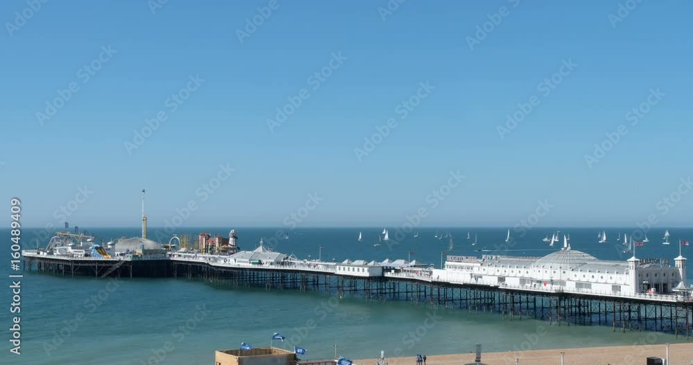 Time lapse view of many sailing boats in a race (regatta) around Brighton pier