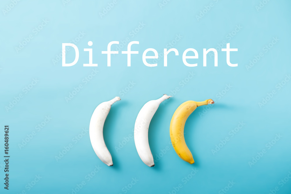 White and yellow bananas on pastel blue background. Minimal fashion, flatlay , top view. Albino Different Creativity Creative Thinking Ideas Concept White and yellow bananas on pastel blue background. Minimal fashion, flatlay , top view. Albino Different Creativity Creative Thinking Ideas Concept