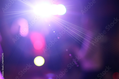 Blurred colorful lights in disco party photo