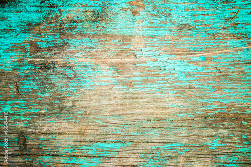 Wooden texture, turquoise cracked paint