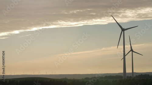Wallpaper Mural Wind turbine farm with rays of light at sunset, Europe. Torontodigital.ca