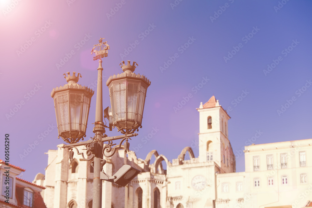 Old street lamp on a classical facade in Lisbon