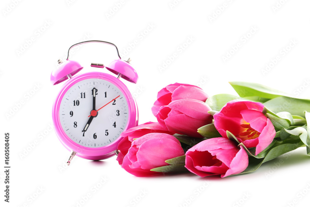 Bouquet of pink tulips with alarm clock isolated on a white Bouquet of pink tulips with alarm clock isolated on a white