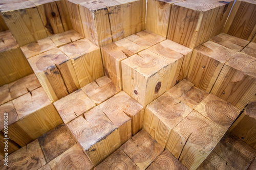 Wooden squares. Decoration of premises with natural wood. The figure is made of wood.