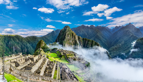 Overview of Machu Picchu, agriculture terraces and Wayna Picchu peak in the background photo