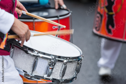 marching drummer with a snare drum - blurry - close up