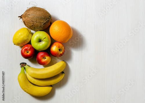 tropical fruits on white wooden table