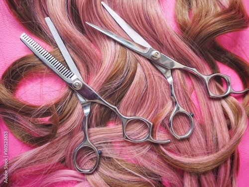 Hair cutting shears on pink background