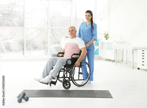Senior disabled man with yo...