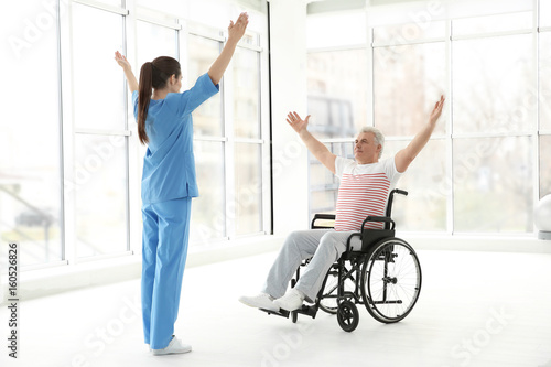 Senior disabled man with yo...