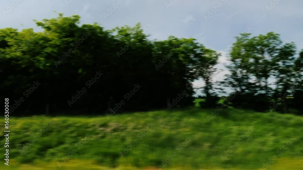 Travel through the beautiful countryside of Hungary. View from the window of a moving car Travel through the beautiful countryside of Hungary. View from the window of a moving car