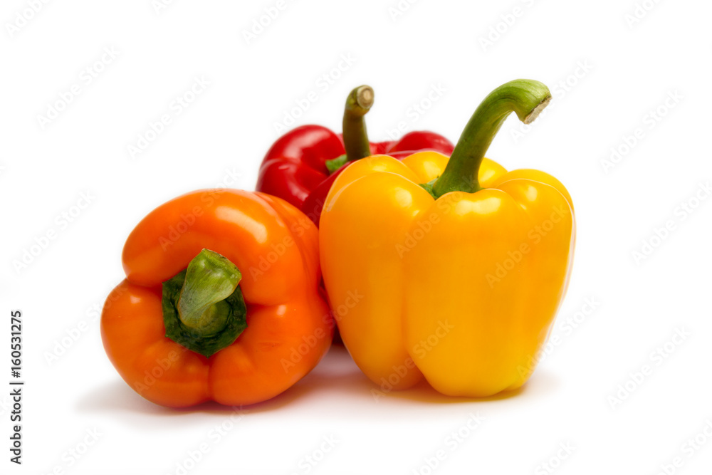 three bell peppers (paprika) isolated on white background.
