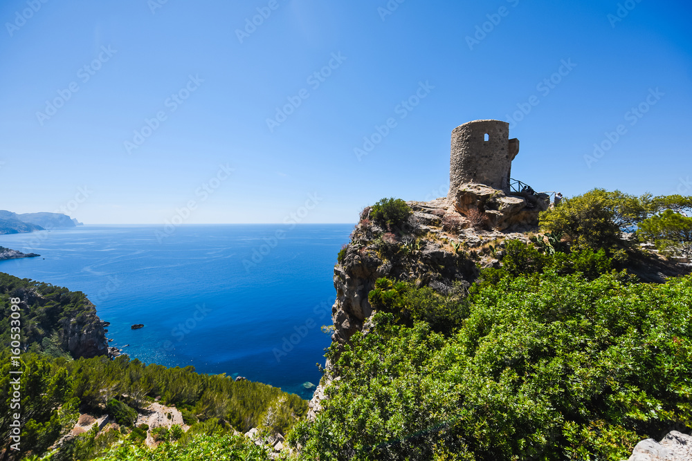 Beautiful travel landscape of Mallorca island of Spain on a sunny day a blue sky and azure sea near stony rocks