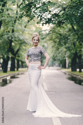 Beautiful young woman in a prom dress