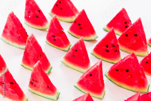 Tasty slices of juicy watermelon on white background. Top view