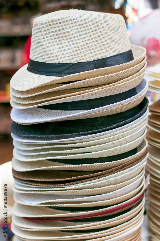 Pile of hats in a street market.