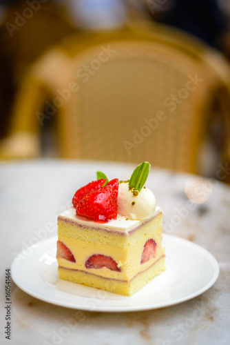 Strawberry Chiffon Entremet cake on white china plate