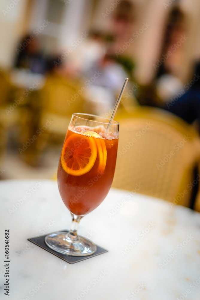 ice lemon tea in a atall glass with three lemon slices ice lemon tea in a atall glass with three lemon slices