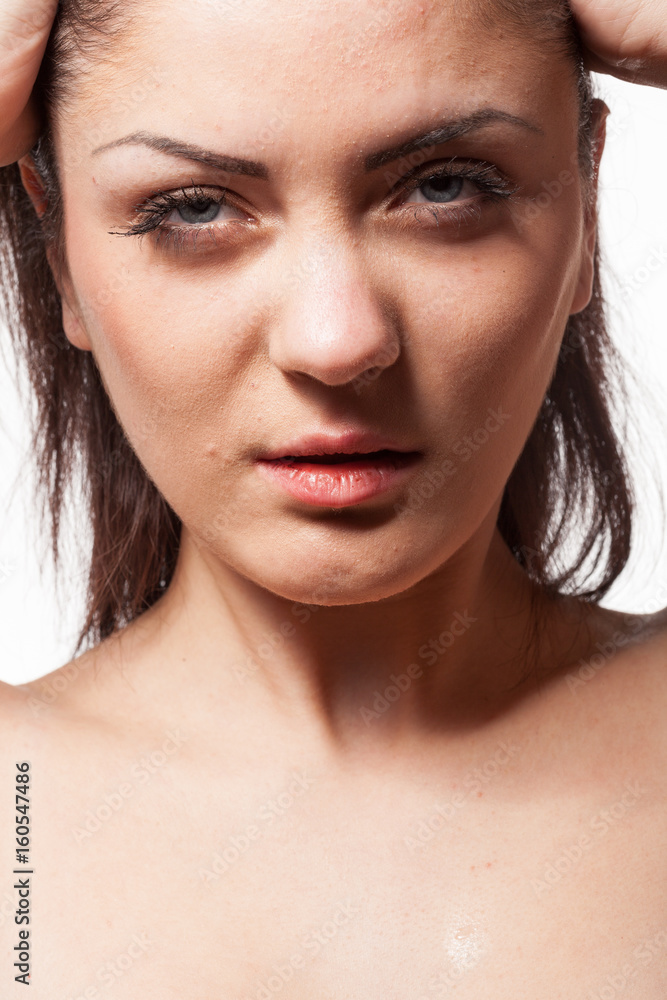 Fototapeta premium Portrait of gorgeous model posing in fashion style. Wet hairs. Studio posing