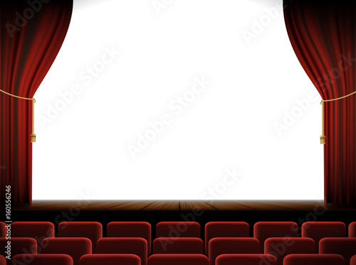 White screen in the cinema with a stage and chairs.