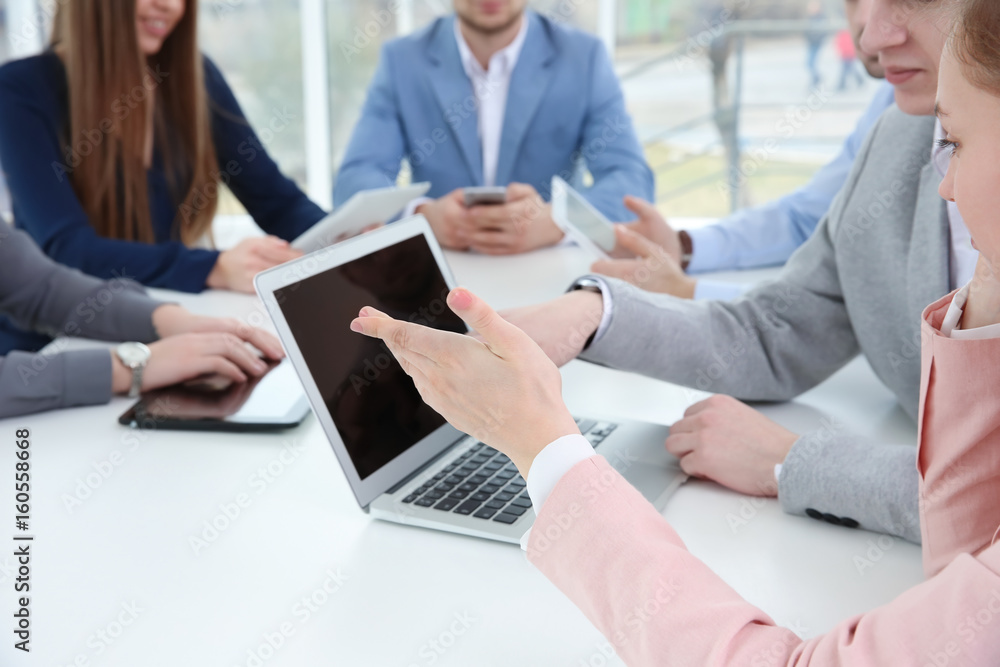 Team work concept. People sitting at table in office and using digital devices Team work concept. People sitting at table in office and using digital devices