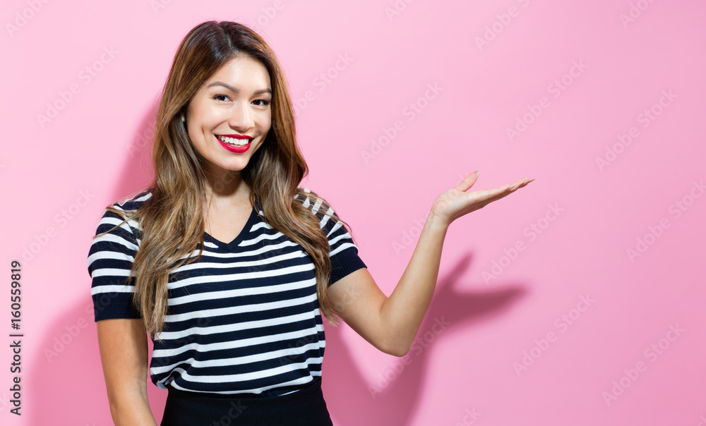 Young woman with displaying hand gesture Young woman with displaying hand gesture