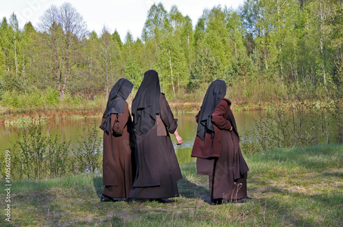 Nuns walking in park, Belarus