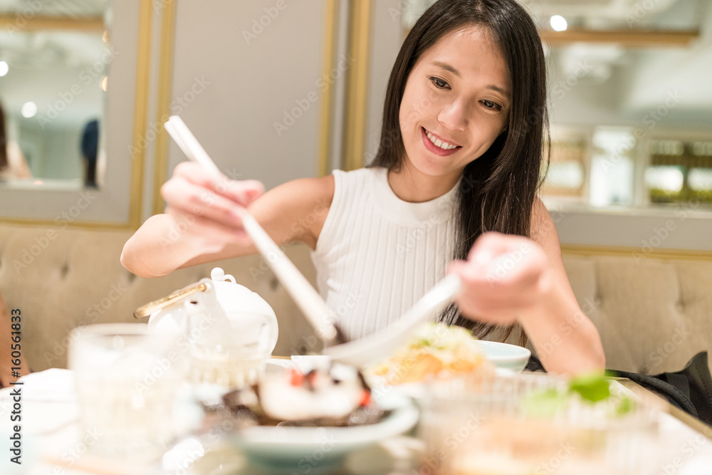 Woman enjoy dinner in restaurant