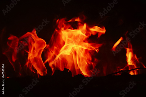 Fire Flame Texture With Motion Blur Effect Over Black Background