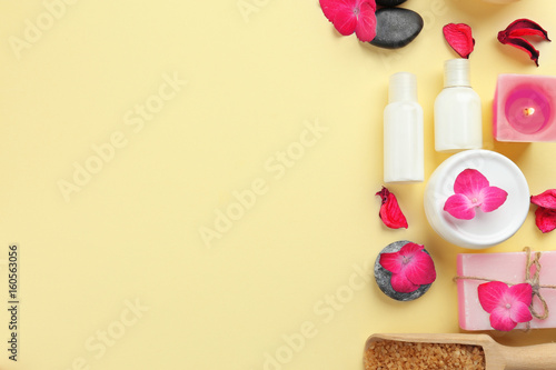 Beautiful composition of cosmetics with hortensia flowers on beige background