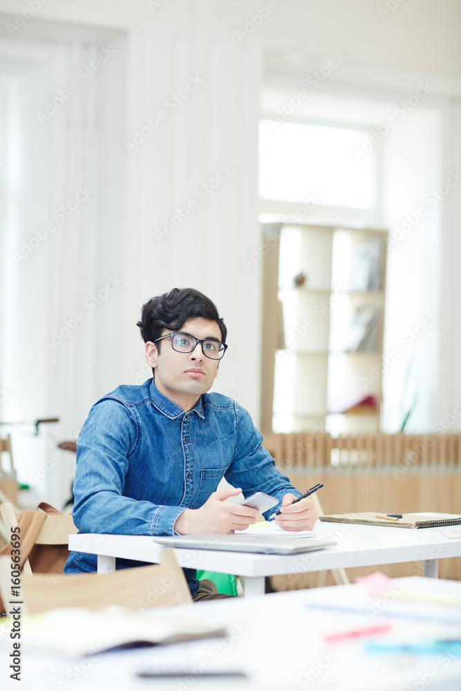 Serious man brainstorming while planning work Serious man brainstorming while planning work