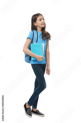 Cute pretty girl with books and schoolbag on white background