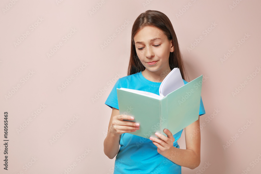 Cute pretty girl with book on color background Cute pretty girl with book on color background