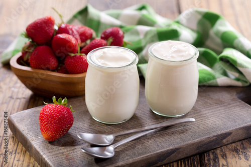 yogurt in a glass jars with fresh strawberries