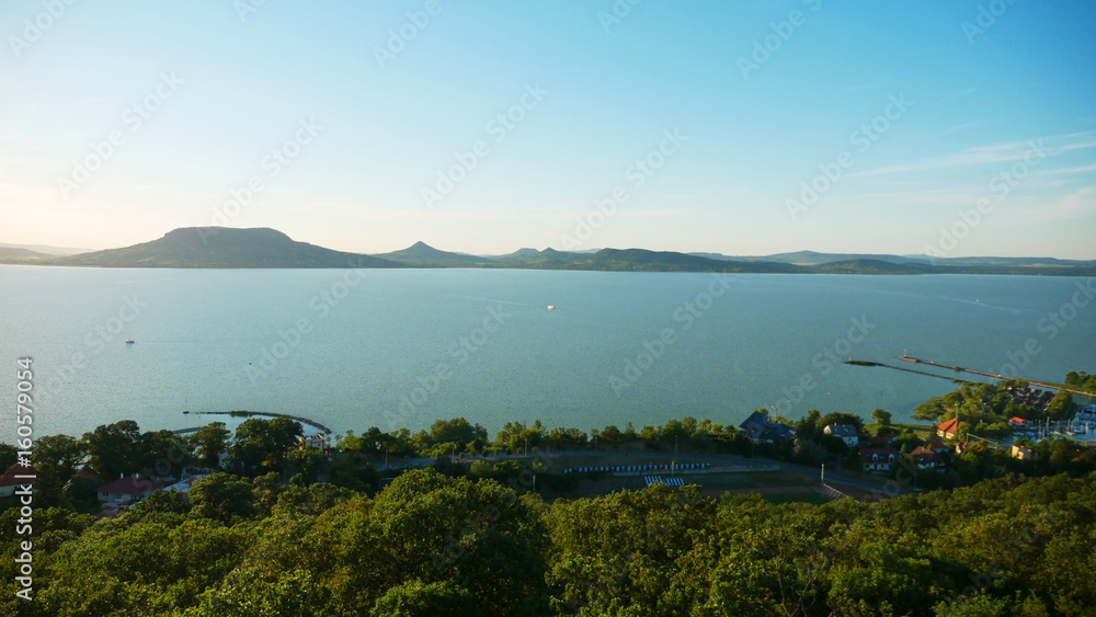 One of Europe's largest lakes - Balaton. Popular tourist tours from many continental countries. Shallow fast warming lake.