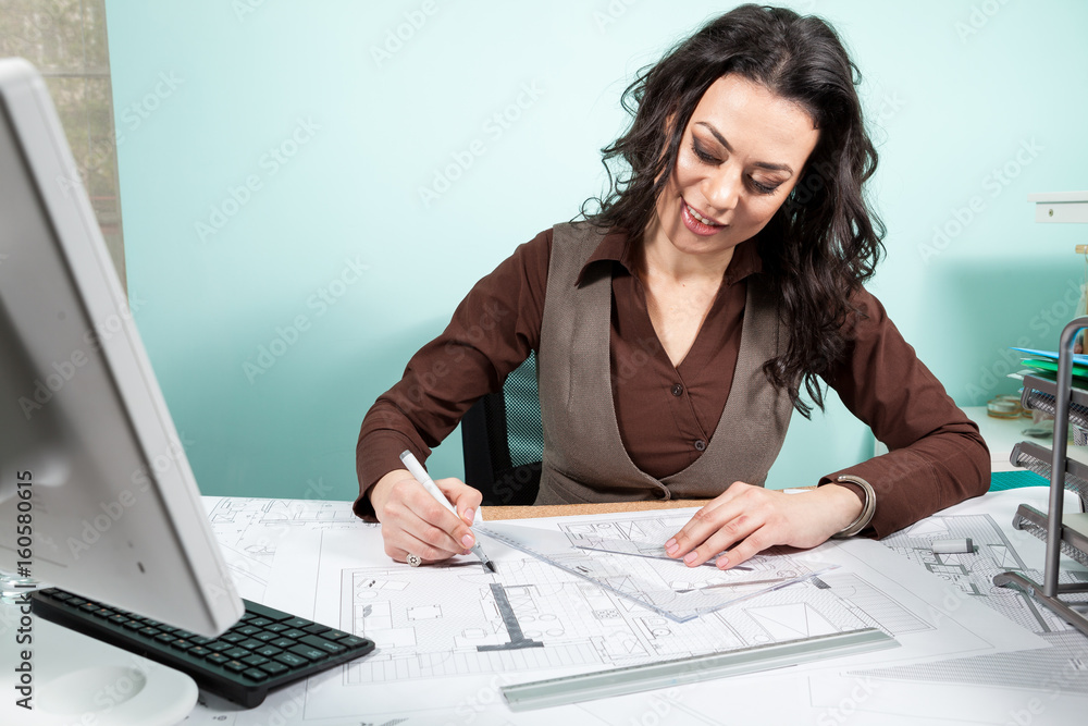 Woman architect working on blueprints. Working on new projects. Architecture and design Woman architect working on blueprints. Working on new projects. Architecture and design