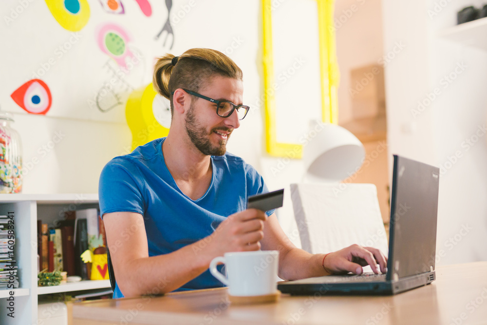 online shopping. Man using his credit card for online shopping online shopping. Man using his credit card for online shopping