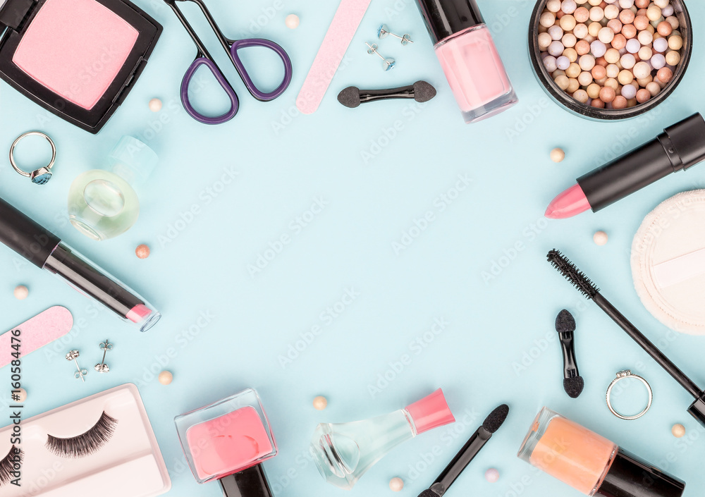 set of professional decorative cosmetics, makeup tools and accessory on blue background with copy space for your text. beauty, fashion, party and shopping concept. flat lay frame composition, top view set of professional decorative cosmetics, makeup tools and accessory on blue background with copy space for your text. beauty, fashion, party and shopping concept. flat lay frame composition, top view