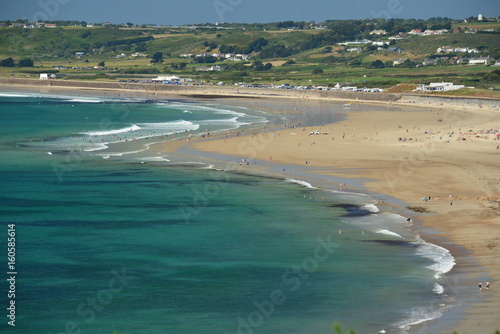 St Ouens Bay, Jersey, U.K. Telephoto image of a popular beach in the Summer.