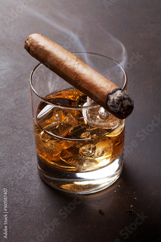 Whiskey with ice and cigar photo