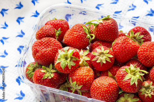 Juicy strawberries on a waffle tablecloth