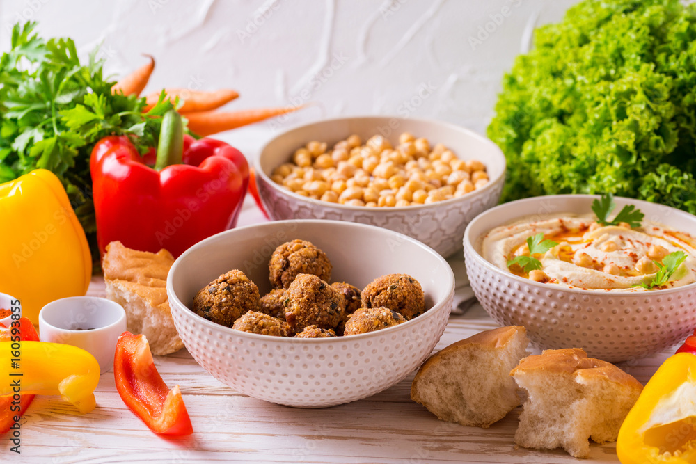 Falafel, pita, hummus and chickpea with vegetables. horizontal view Falafel, pita, hummus and chickpea with vegetables. horizontal view