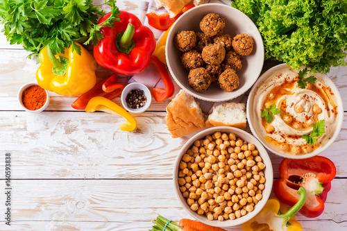 Falafel, pita, hummus and chickpea  with vegetables. Top view