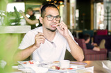 funny portrait man eating in restaurant