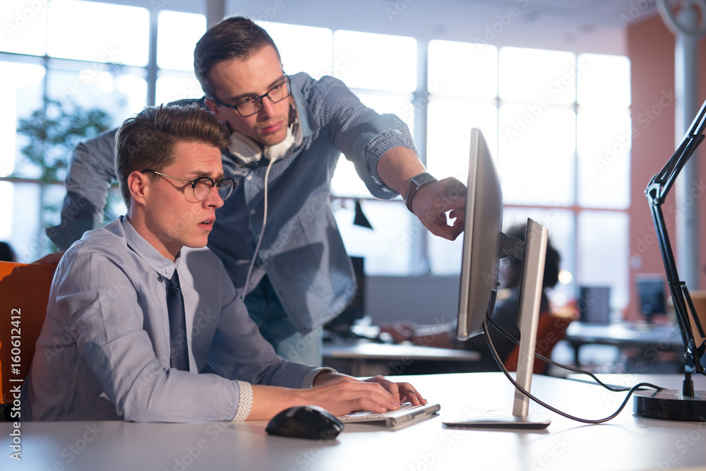 Two Business People Working With computer in office Two Business People Working With computer in office
