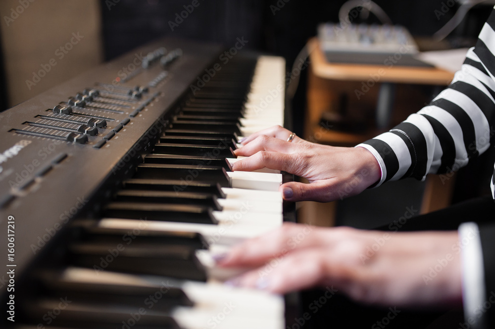 Fototapeta premium Hands music, synthesizer, piano