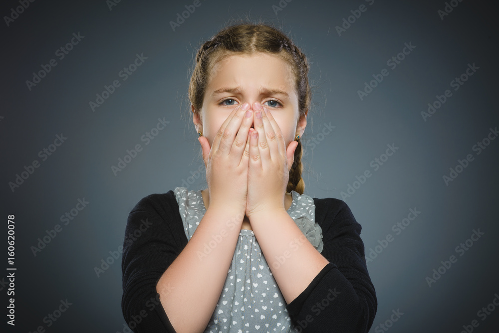 Closeup Scared and shocked little girl. Human emotion face expression Closeup Scared and shocked little girl. Human emotion face expression