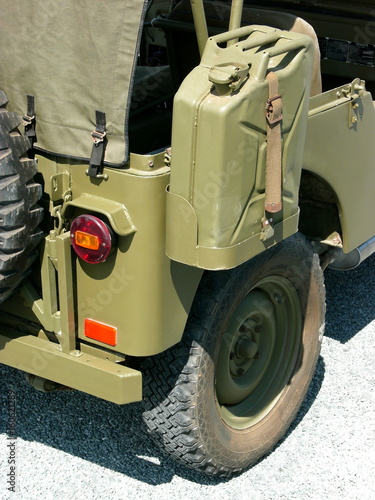 Benzinkanister in Olivgrün eines Geländewagen der amerikanischen Armee im Sonnenscheinbeim Oldtimertreffen am Oldtimer-Park Lippe in Lage bei Detmold in Ostwestfalen-Lippe photo